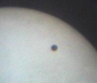 The transit of Venus in June 2004, projected through a telescope on to a piece of card. Click for a larger version, 7 KB (Copyright Martin J Powell 2004)
